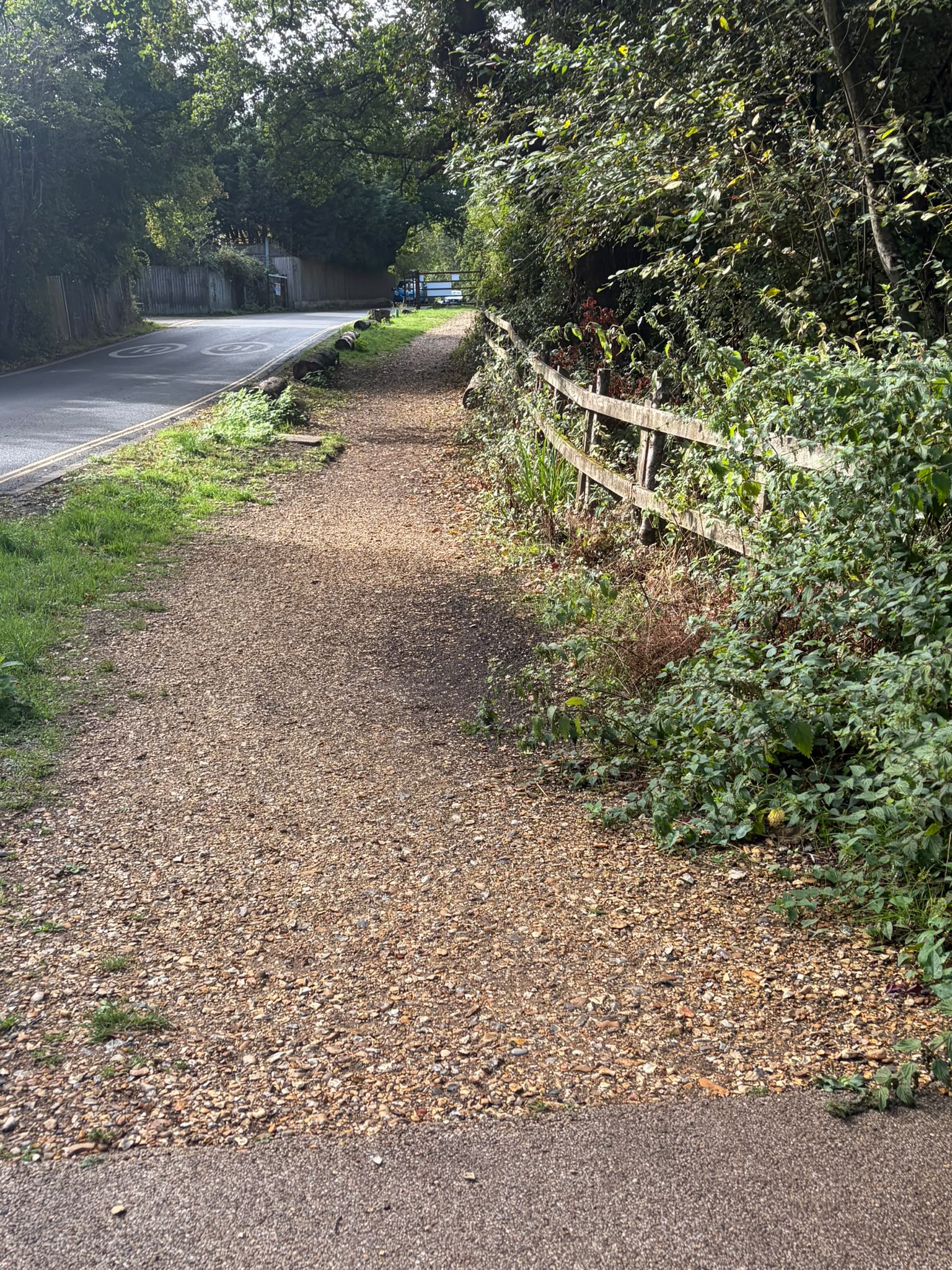 Gravel path with a gradual incline leading in from the road